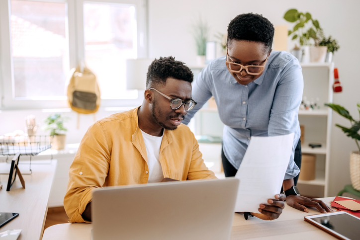 A couple selecting a retirement plan for their business.