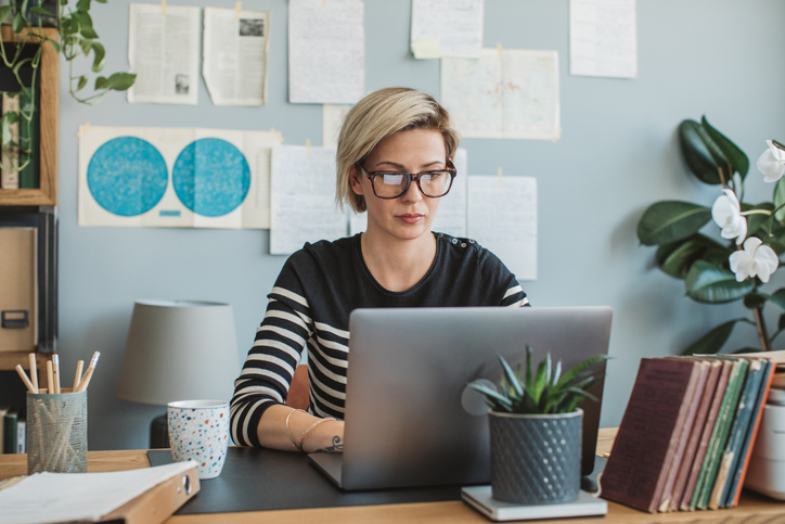 A woman researching capital gains tax brackets.