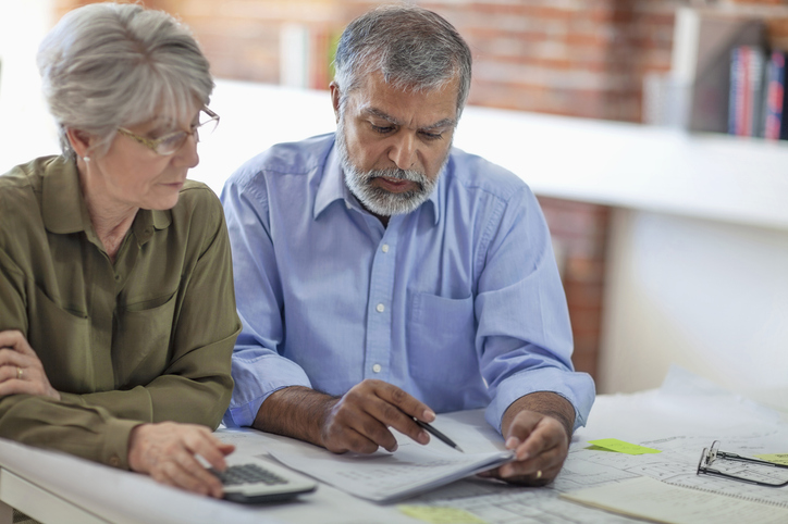 A couple looking up how to claim Social Security benefits.