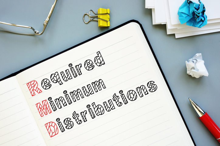 Required Minimum Distributions (RMDs) is shown on the conceptual business photo.