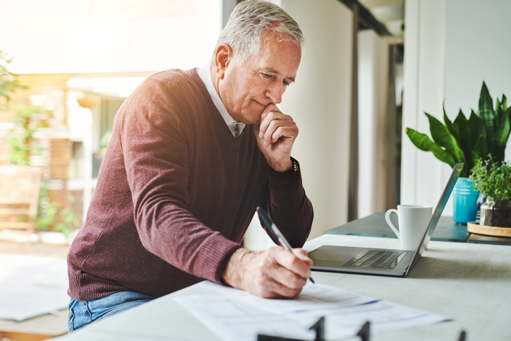 A senior reviewing his 401(k) plan.
